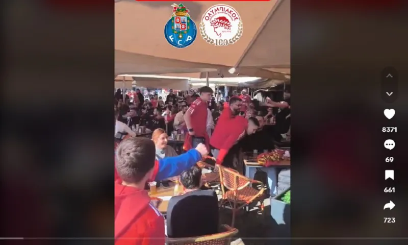 Καφετέριες και εστιατόρια ντύθηκαν στα ερυθρόλευκα πριν το Πόρτο - Ολυμπιακός